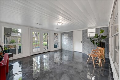 This Sun Room has a lot of natural lights. Just Tipping. Orchids will bloom here.