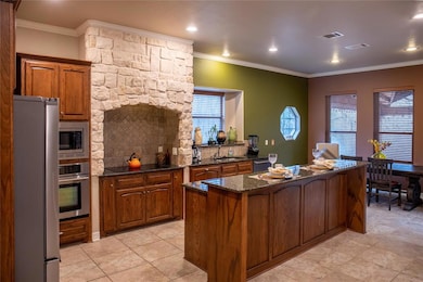 Family cook will love this kitchen!  Elegant stone