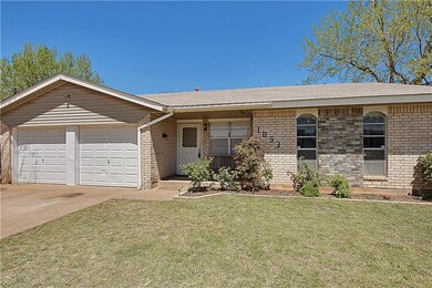 Vinyl siding and great flower beds make this a gre