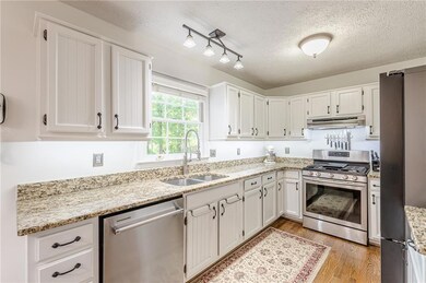 Kitchen with appliances with stainless steel finis