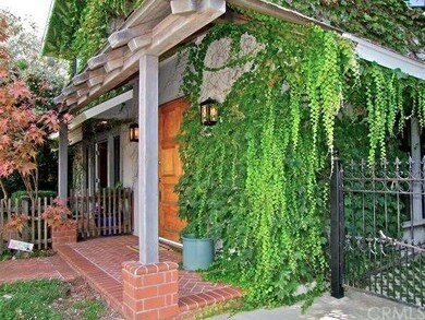 Beautiful oversized antique front door and bricked