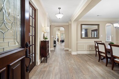 The entryway welcomes you with elegant archways, d