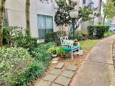 Charming garden area with lush greenery and a cozy