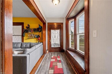 Wood floored foyer entrance featuring a wealth of 