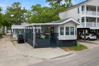 View of front of house featuring a carport