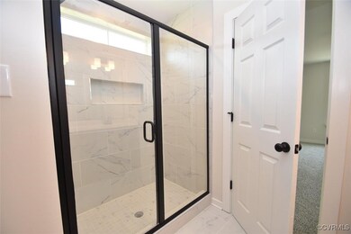 Bathroom featuring walk in shower