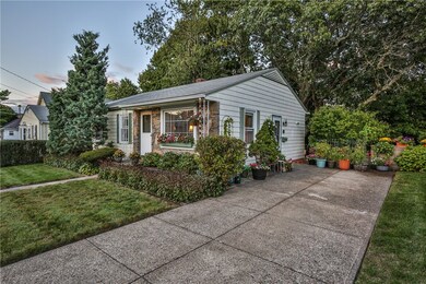 Front with view of concrete driveway.