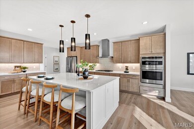 Kitchen with white cabinetry, light wood-type flooring, decorative backsplash, pendant lighting, and recessed lighting