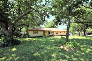 SOME GREAT OLD TREES GRACE THE FRONT OF THIS HOME