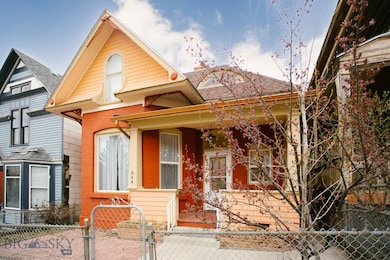 Bright colors, gingerbread trim, and rounded windo