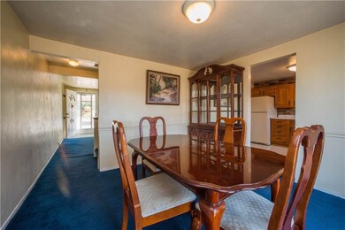 The dining room also has hardwood flooring beneath