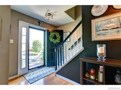 Warm welcoming foyer with hardwoods, plenty of nat