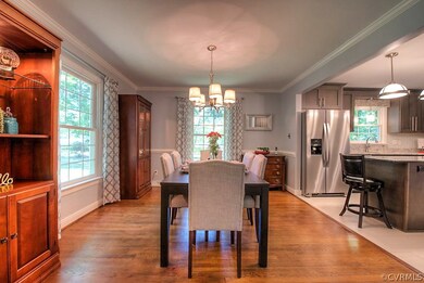 Casual Dining Room w. chandelier. Hardwood floors.