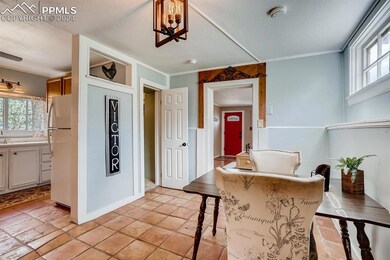 Kitchen featuring white cabinetry, a kitchen break