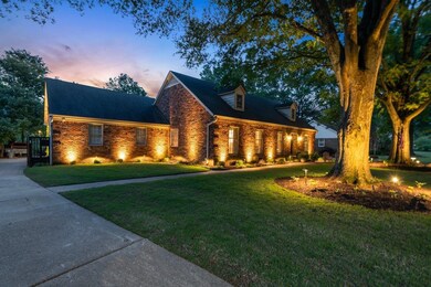 View of front of house with a front yard, concrete