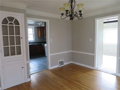Lovely built-in china cabinet in dining room provi