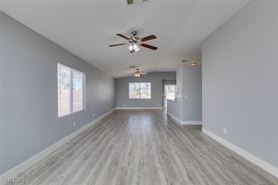 Spare room featuring visible vents, baseboards, ce