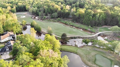 Aerial shows 5th hole of golf course, this home ba