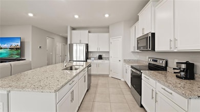 Kitchen with Pond Views, Granite Counters, Stainless Steel Appliances