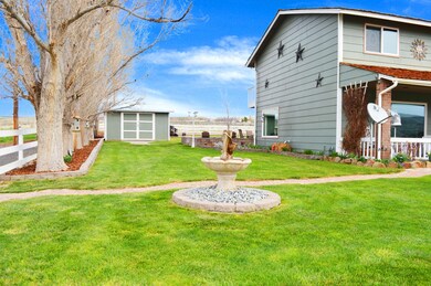 SIDE OF HOME WITH FOUNTAIN