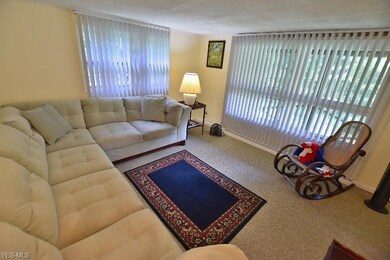 The living room has great natural light with 2 lar