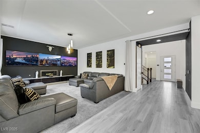 Living room featuring wood finished floors, recess