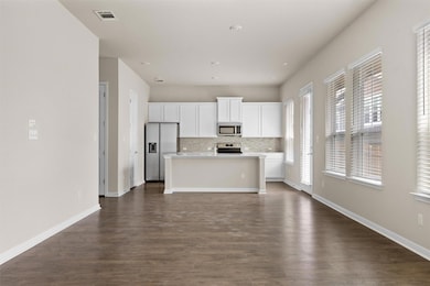 Kitchen with appliances with stainless steel fini
