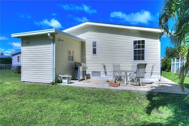 Back of house with a patio area