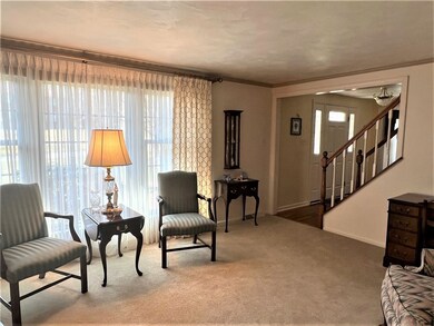 ANOTHER VIEW OF THE LIVING ROOM THAT OFFERS A LARG