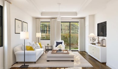 Great room with coffered ceiling and crown moulding