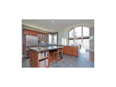 Stainless steel counter top surrounds gas stove wi