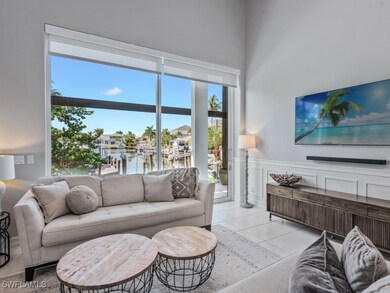 Living room featuring wainscoting and light tile p
