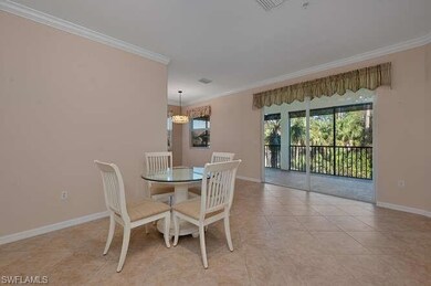 Tiled dining area featuring ornamental molding