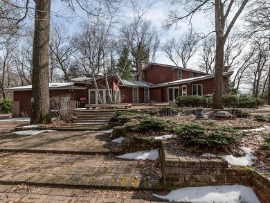 Enjoy the outdoors from the wood deck or brick pat