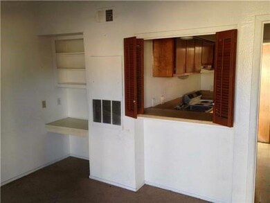 Kitchen with baseboards, range, and visible vents