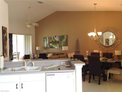 Kitchen featuring white cabinetry, a sink, range, 
