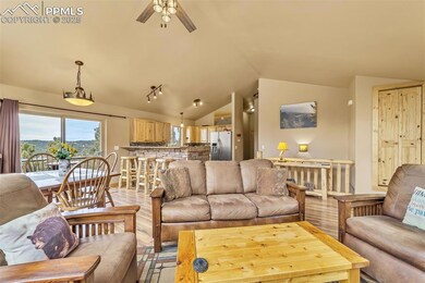 Living area with vaulted ceiling, light wood-style