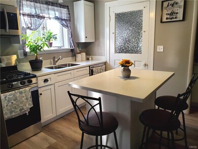 Kitchen Island & Entry to 1st Floor Laundry Room