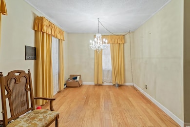 Unfurnished dining area with an inviting chandelie