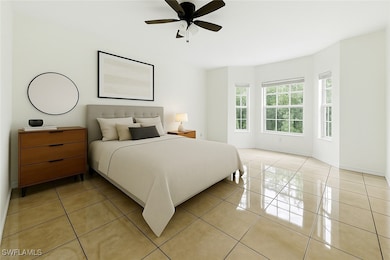 Bedroom with light tile patterned floors and ceili