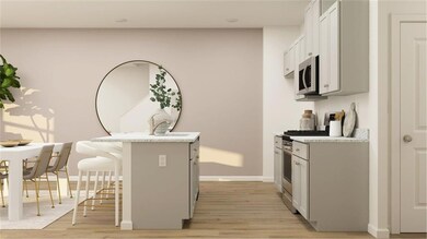 Kitchen with a breakfast bar, light wood-type flooring, stainless steel appliances, and sink