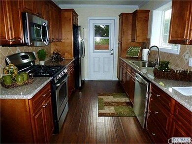 Large beautiful kitchen with new cabinets and gran