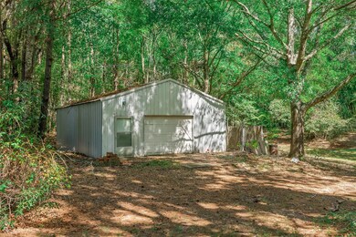View of outdoor structure featuring a garage