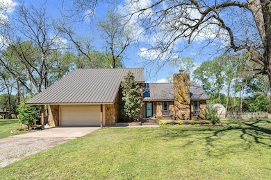 View of front of home with concrete driveway, a ch