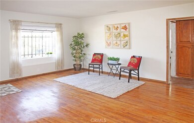 family room with hardwood floors and bay window