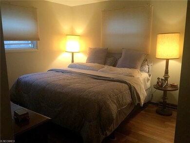 Master Bedroom with Hard Wood Floor and Vinyl Wind