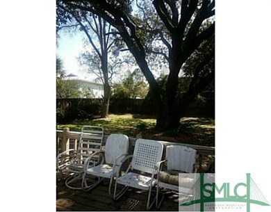 View. Ancient Oak Frames this Private Back Yard