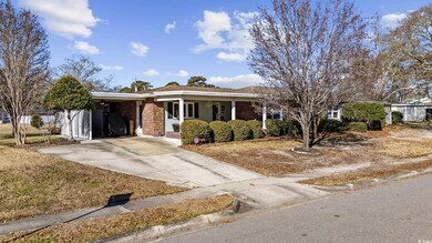 Single story home featuring a carport