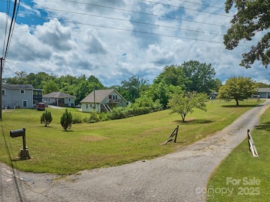 View of lot from existing driveway to 181 Moody Ave