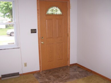 Entry with newer door and tile flooring